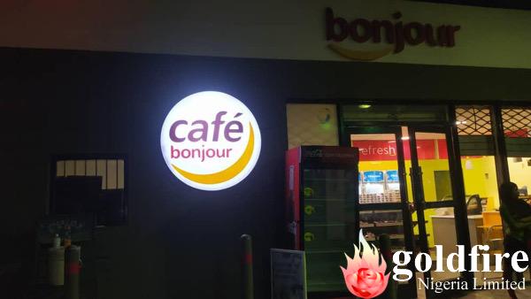 Illuminated Cafe Bonjour signage at Sango Station for Total PLC produced and installed by Golfire Nigeria Limited.