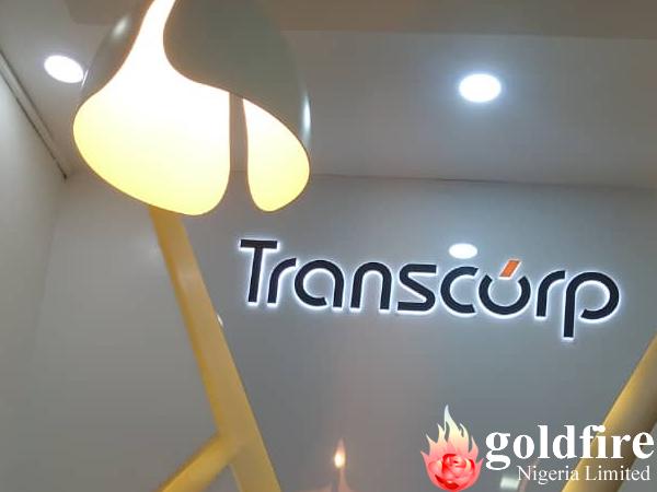Illuminated Transcorp pylon sign, wall sign and internal signage produced, delivered and Installed by Goldfire Nigeria limited.