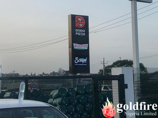 Illuminated pole signage for Dodo Pizza - Gbagada produced and installed by Goldfire Nigeria Limited.