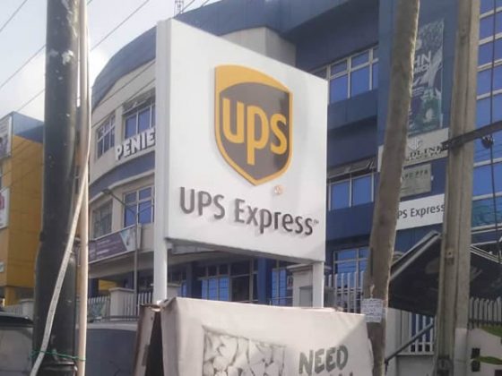 UPS wall fascia and twin Pole signage at Ring Road, Ibadan produced by Goldfire NIgeria Limited