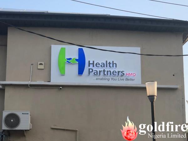 Day photos of Health Partners HMO - Ribadu, Road, Ikoyi signage produced and installed by Goldfire Nigeria Limited.