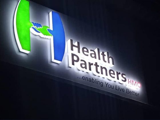 Night photos of Health Partners HMO - Ribadu, Road, Ikoyi signage produced and installed by Goldfire Nigeria Limited.