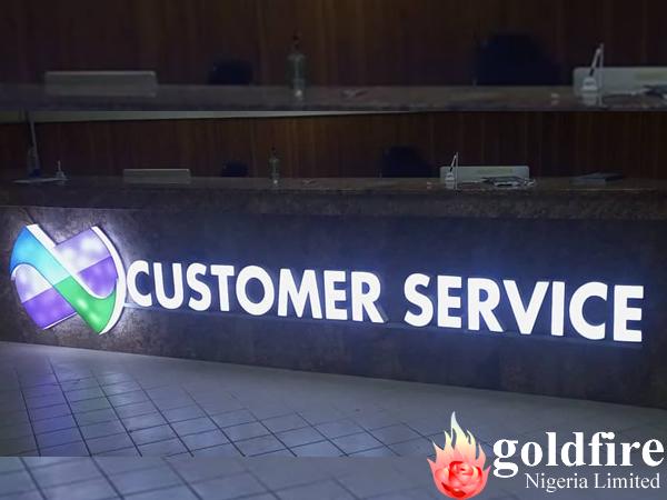 Reception Signage for Nexim Bank - Abuja produced and installed by Goldfire Nigeria Limited.