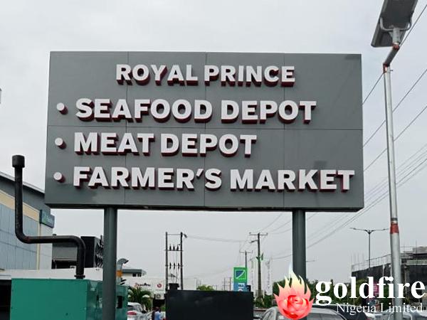 Front and rear views of the illuminated signage for Royal Prince Super Market -  Lekki, Admiralty Way, Lagos produced by Goldfire Nigeria Limited