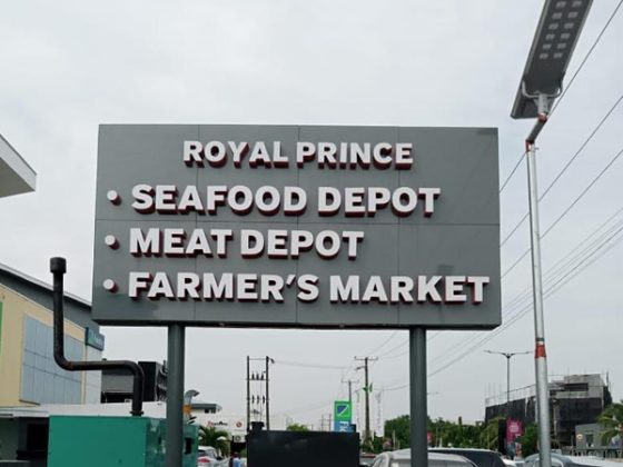 Front and rear views of the illuminated signage for Royal Prince Super Market -  Lekki, Admiralty Way, Lagos produced by Goldfire Nigeria Limited