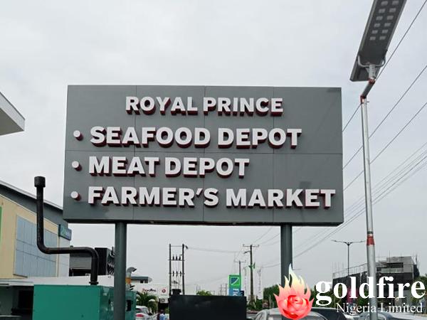 Front and rear views of the illuminated signage for Royal Prince Super Market - Lekki, Admiralty Way, Lagos produced by Goldfire Nigeria Limited